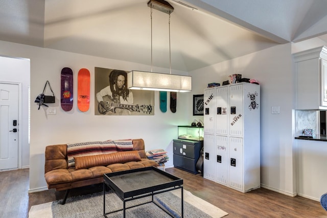 living room featuring lofted ceiling and hardwood / wood-style floors