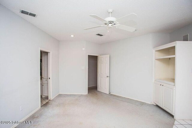 5110 1st Pl, Lubbock, TX 79416 - unfurnished bedroom featuring light colored carpet, baseboards, ensuite bath, ceiling fan, and recessed lighting