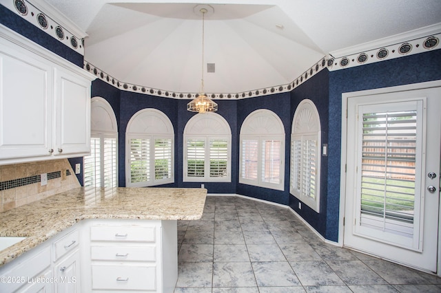 5110 1st Pl, Lubbock, TX 79416 - unfurnished dining area featuring lofted ceiling and baseboards