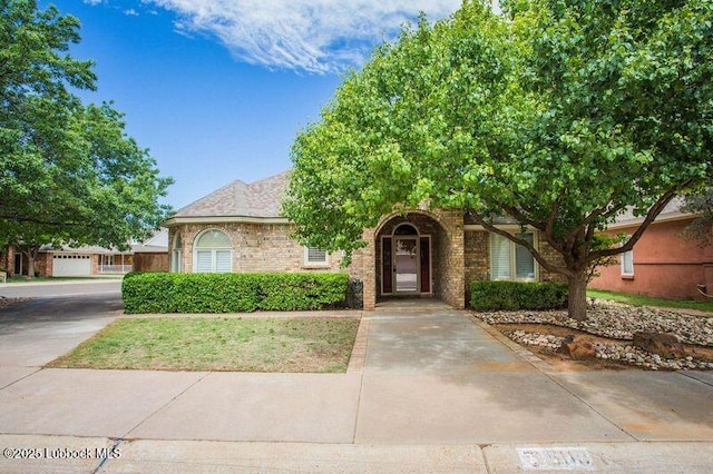 5110 1st Pl, Lubbock, TX 79416 - obstructed view of property with brick siding