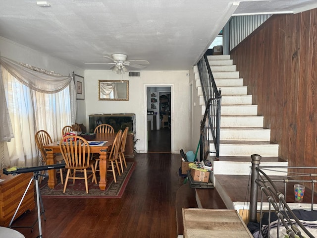 dining room featuring hardwood / wood-style flooring, a textured ceiling, and ceiling fan