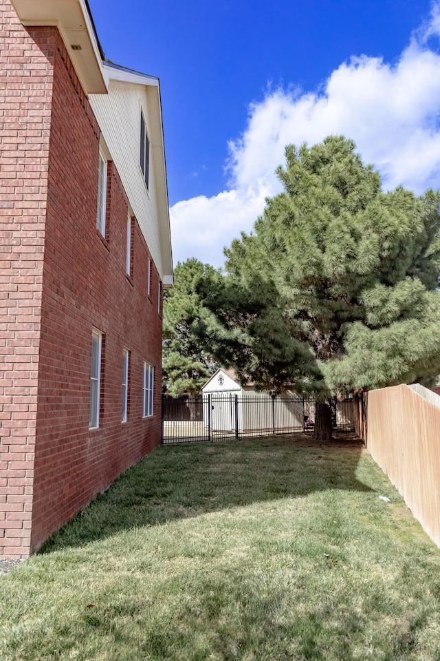 view of yard with a fenced backyard