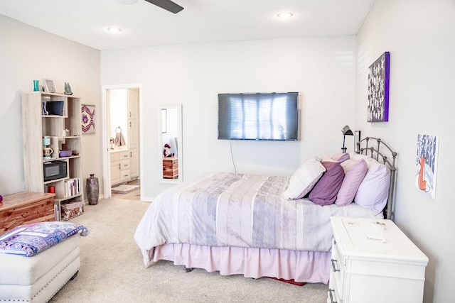 bedroom featuring connected bathroom, recessed lighting, ceiling fan, and light colored carpet