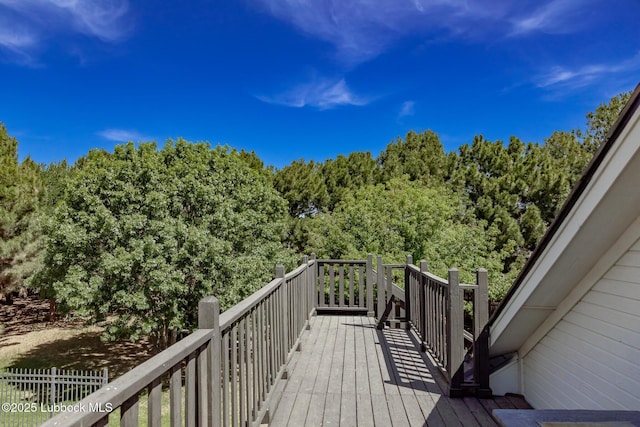 7416 95th St, Lubbock, TX 79424 - wooden terrace featuring a wooded view