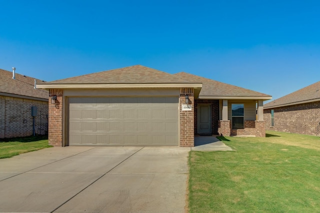 view of front of house with a garage and a front yard