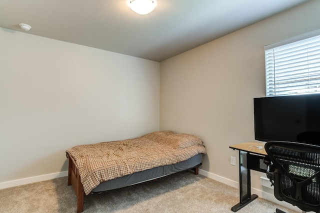 bedroom featuring light carpet