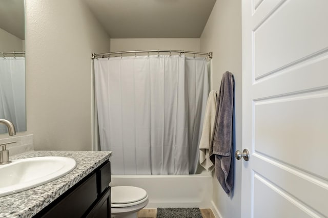 full bathroom featuring vanity, shower / bath combo, and toilet