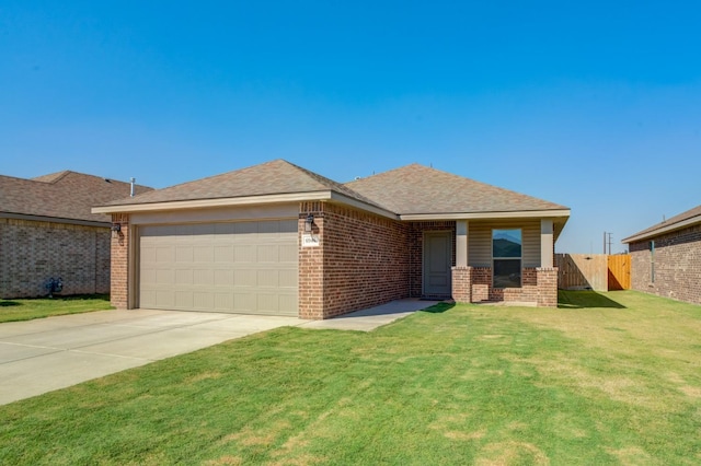 view of front of home with a garage and a front yard