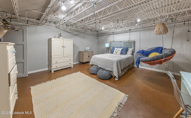 3417 56th St, Lubbock, TX 79413 - bedroom featuring baseboards and concrete floors