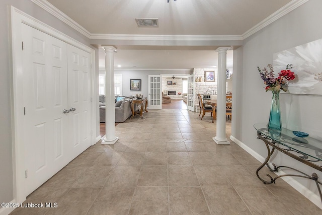 3417 56th St, Lubbock, TX 79413 - hallway with decorative columns, ornamental molding, and light tile patterned floors