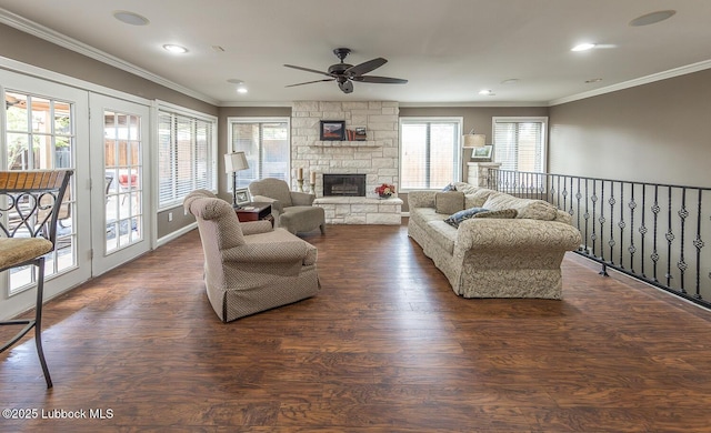3417 56th St, Lubbock, TX 79413 - living room with ceiling fan, crown molding, a stone fireplace, dark wood finished floors, and recessed lighting