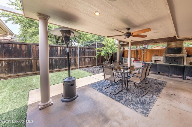 3417 56th St, Lubbock, TX 79413 - fenced backyard with outdoor dining area, a patio area, and a ceiling fan