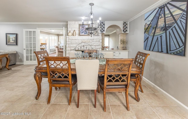 3417 56th St, Lubbock, TX 79413 - dining area with a chandelier, ornamental molding, plenty of natural light, french doors, and light tile patterned floors