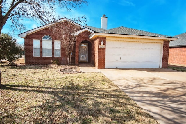 single story home with a garage and a front yard