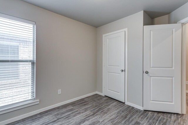 unfurnished bedroom featuring hardwood / wood-style floors