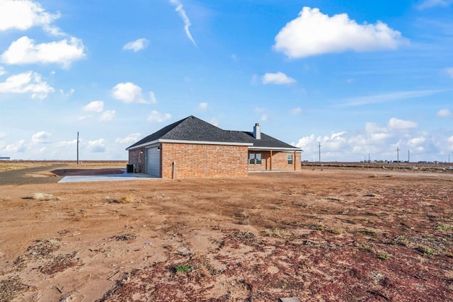 exterior space with a garage