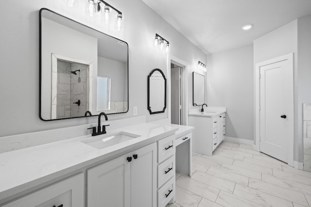 bathroom featuring walk in shower and vanity