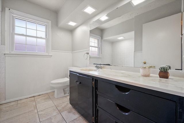 3808 27th St, Lubbock, TX 79410 - bathroom featuring vanity, wainscoting, and tile patterned floors