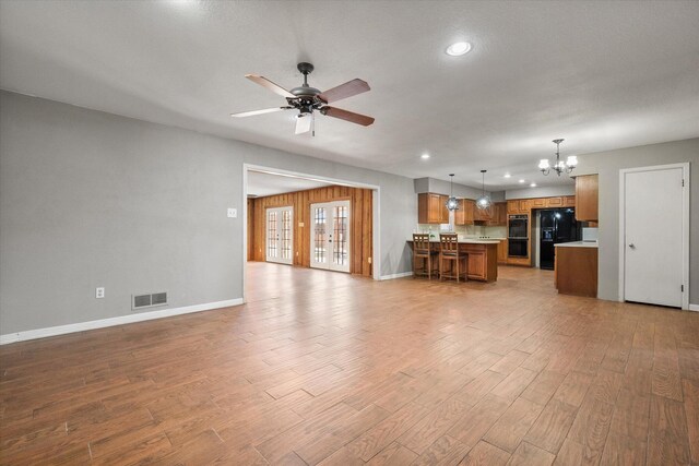 3808 27th St, Lubbock, TX 79410 - living room with a chandelier, a ceiling fan, recessed lighting, and light wood-style flooring