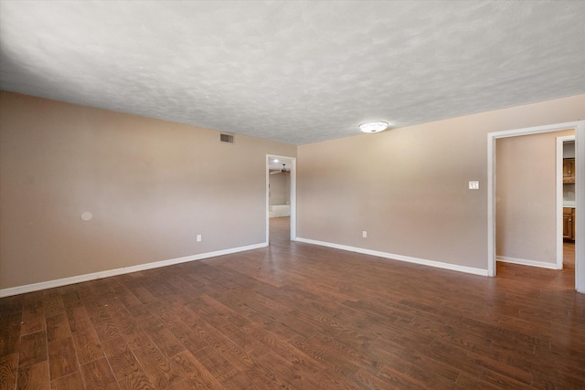 3808 27th St, Lubbock, TX 79410 - unfurnished room with dark wood finished floors and a textured ceiling
