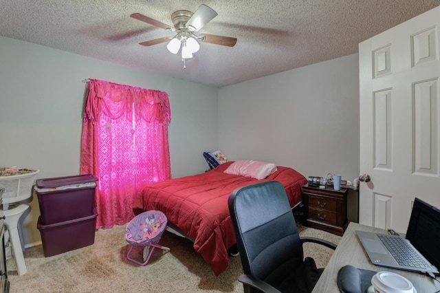 carpeted bedroom featuring ceiling fan and a textured ceiling