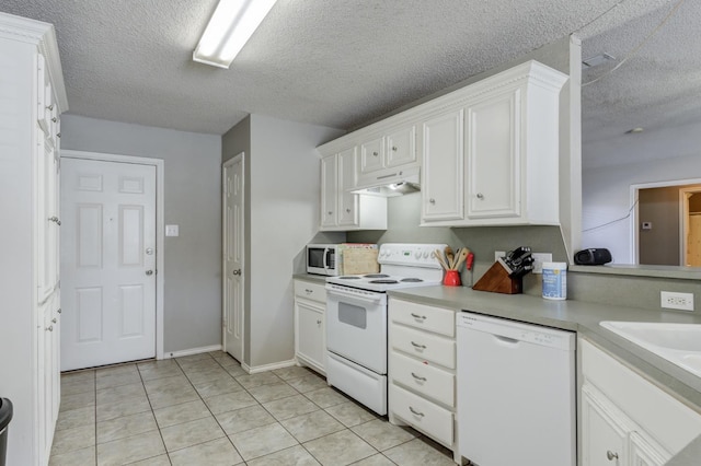 kitchen featuring light tile patterned flooring, sink, white cabinetry, a textured ceiling, and white appliances