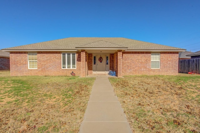 ranch-style house featuring a front lawn