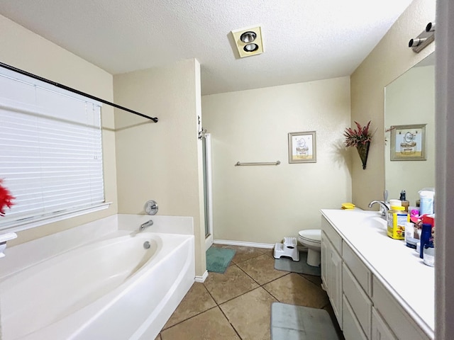 bathroom with a textured ceiling, a garden tub, tile patterned flooring, vanity, and a stall shower