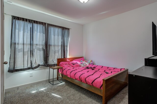 6904 56th St, Lubbock, TX 79407 - bedroom with carpet flooring and baseboards