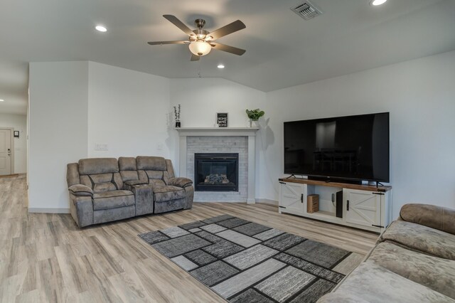 6904 56th St, Lubbock, TX 79407 - living room with wood finished floors, ceiling fan, recessed lighting, a brick fireplace, and baseboards