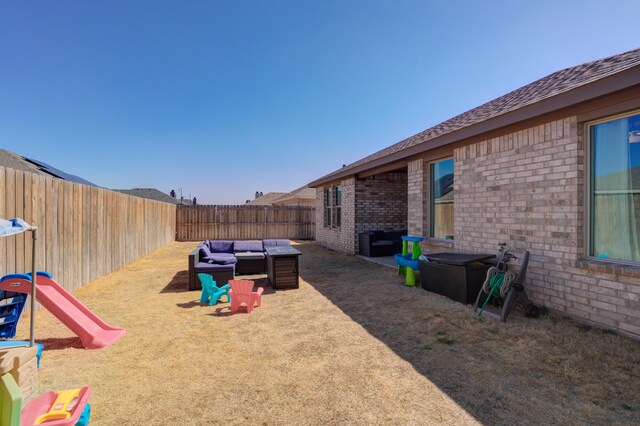 6904 56th St, Lubbock, TX 79407 - fenced backyard with an outdoor living space