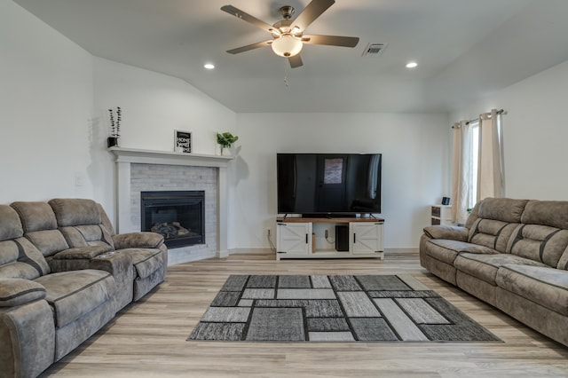 6904 56th St, Lubbock, TX 79407 - living area with ceiling fan, wood finished floors, recessed lighting, a fireplace, and vaulted ceiling