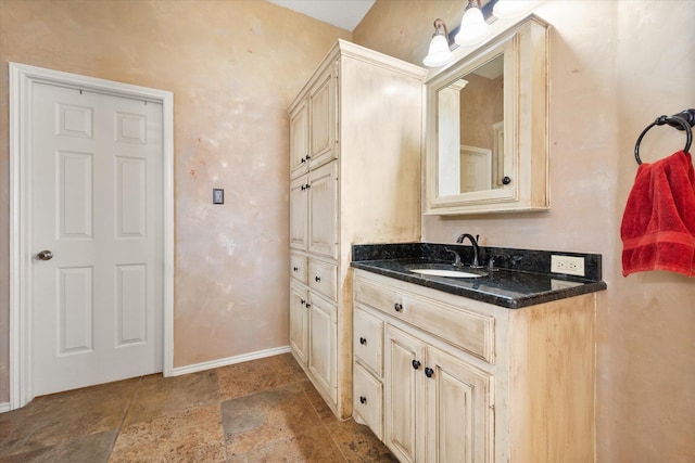 4121 86th St, Lubbock, TX 79423 - bathroom with baseboards, vanity, and stone finish floor