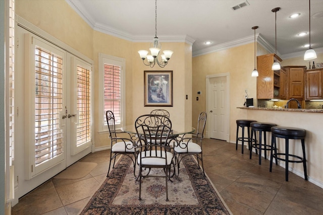 4121 86th St, Lubbock, TX 79423 - dining space featuring a notable chandelier, recessed lighting, ornamental molding, visible vents, and dark tile patterned floors