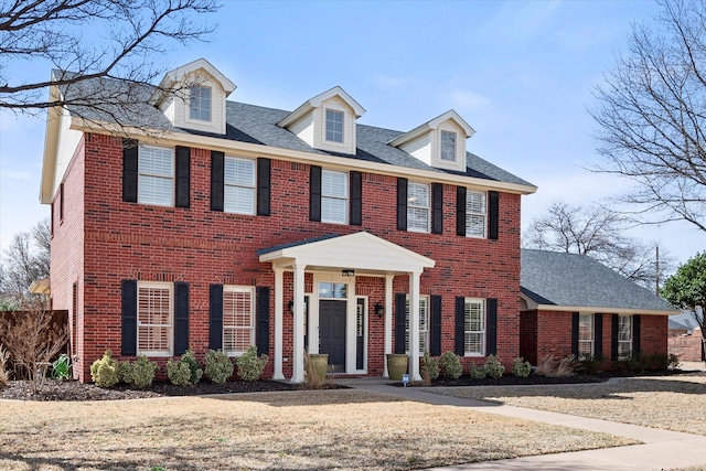 4121 86th St, Lubbock, TX 79423 - view of front facade with a shingled roof and brick siding