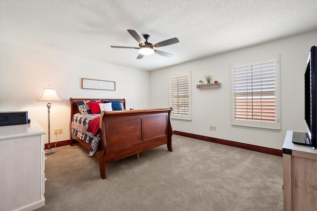 4121 86th St, Lubbock, TX 79423 - bedroom featuring baseboards, light carpet, ceiling fan, and a textured ceiling