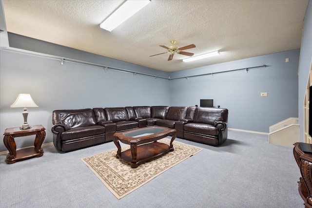 4121 86th St, Lubbock, TX 79423 - carpeted living room featuring a ceiling fan, baseboards, and a textured ceiling