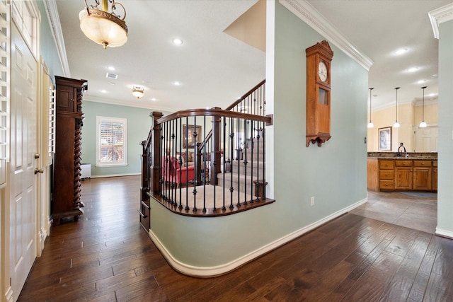 4121 86th St, Lubbock, TX 79423 - hallway featuring dark wood-style flooring, ornamental molding, and baseboards