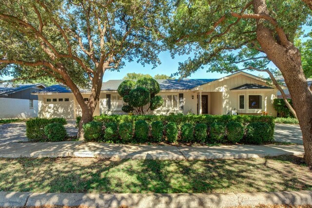 ranch-style home with a garage