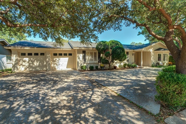 ranch-style house featuring a garage