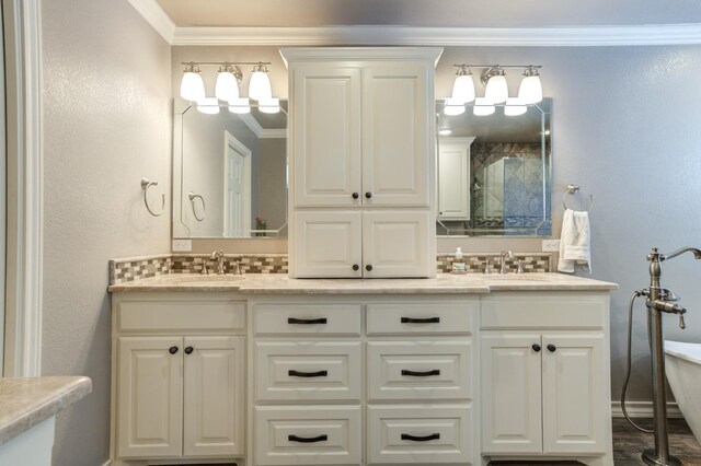 bathroom featuring ornamental molding, vanity, and decorative backsplash