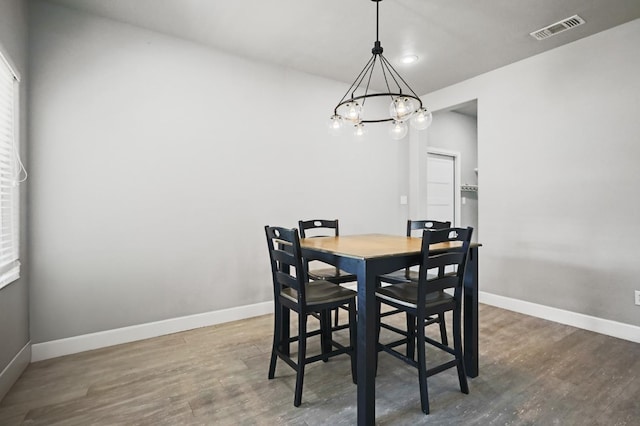 dining area featuring dark hardwood / wood-style floors