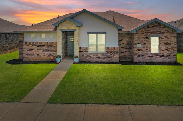 ranch-style house with a lawn