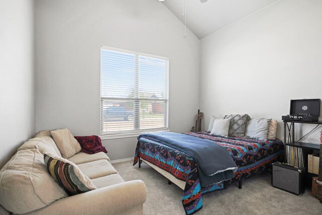 carpeted bedroom featuring vaulted ceiling