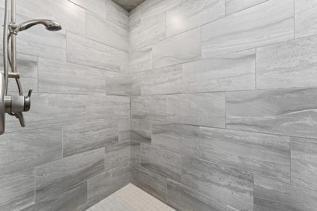 bathroom with a tile shower