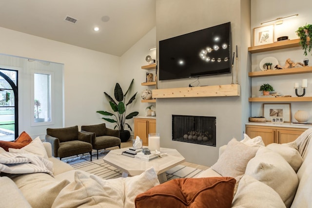7722 47th St, Lubbock, TX 79407 - living area with lofted ceiling, a fireplace, and built in features