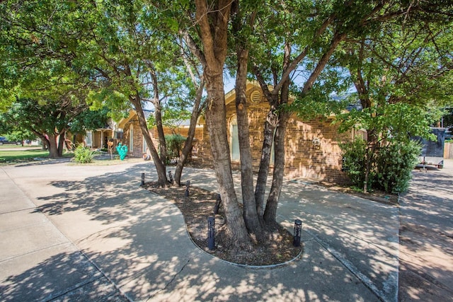 view of property hidden behind natural elements