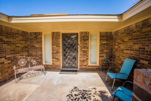 entrance to property with a patio