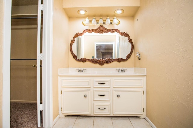 bathroom with vanity and tile patterned flooring