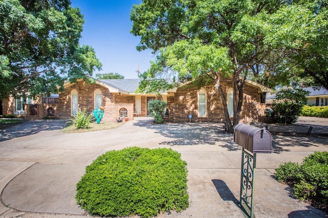 view of front of property featuring brick siding